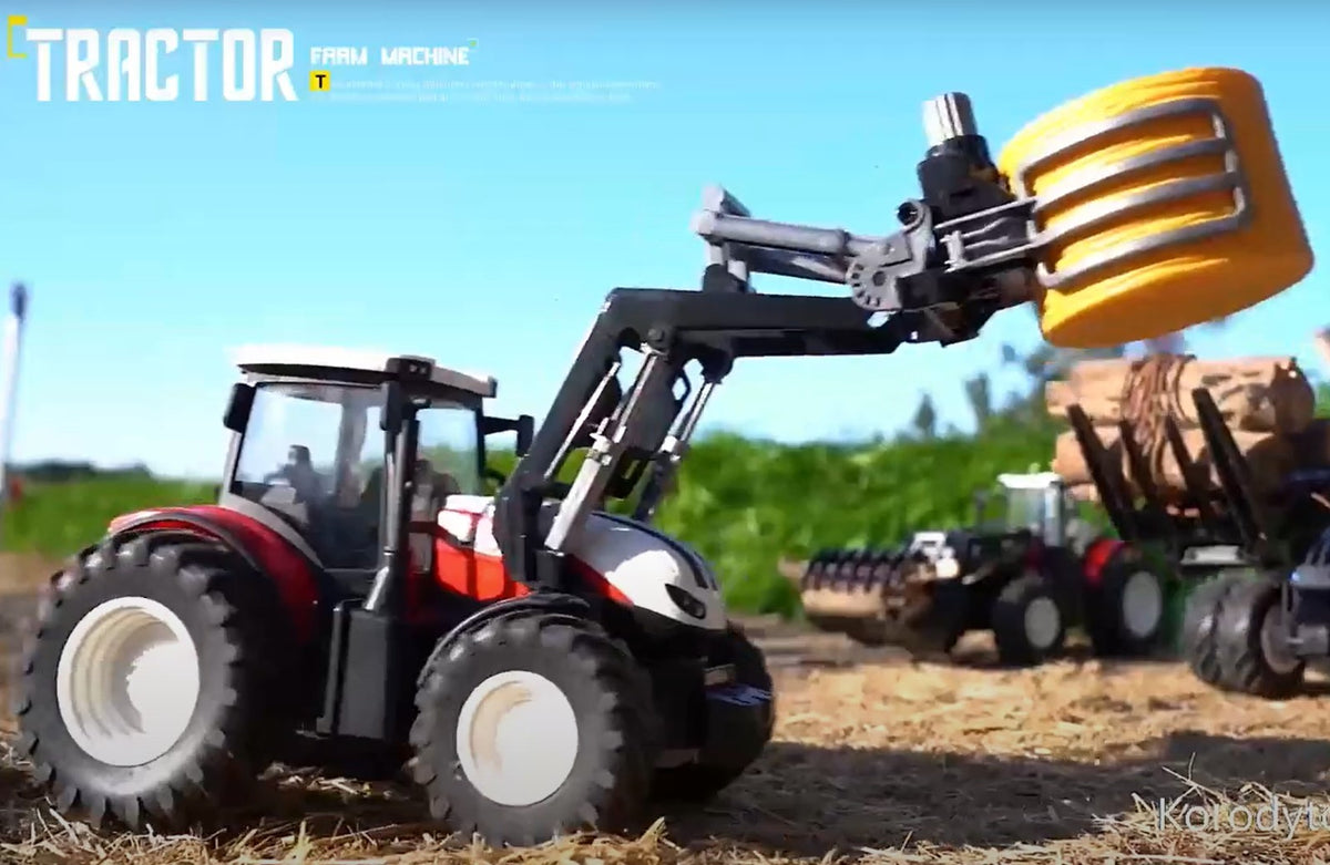 Fjernstyret traktor med løfter til f.eks. halmballer