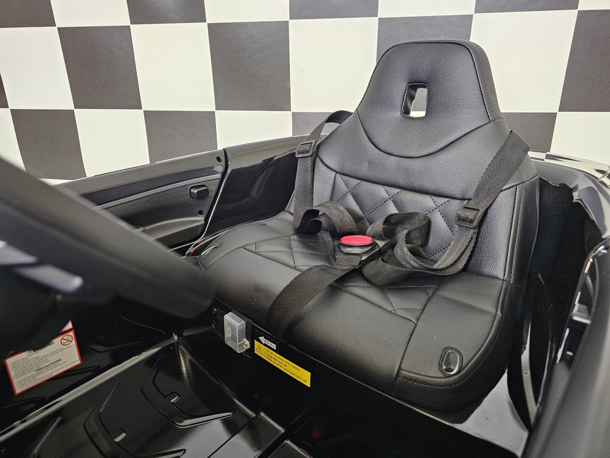 BMW i4 12V elbil för barn – 1 person, svart