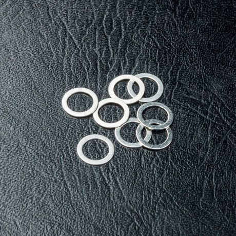 DISC.. Spacer 5X7X0.3 (8)
