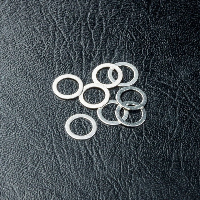 DISC.. Spacer 5X7X0.3 (8)